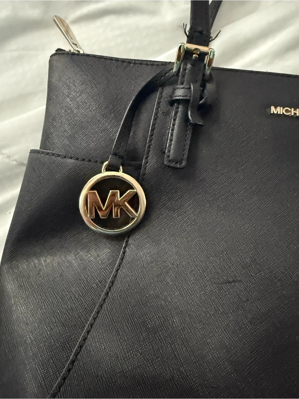 MICHAEL KORS Black Saffiano Tote with Gold Hardware. The straps are messed up
